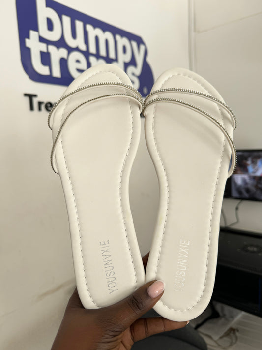 Assymetric strap embellished flat slippers